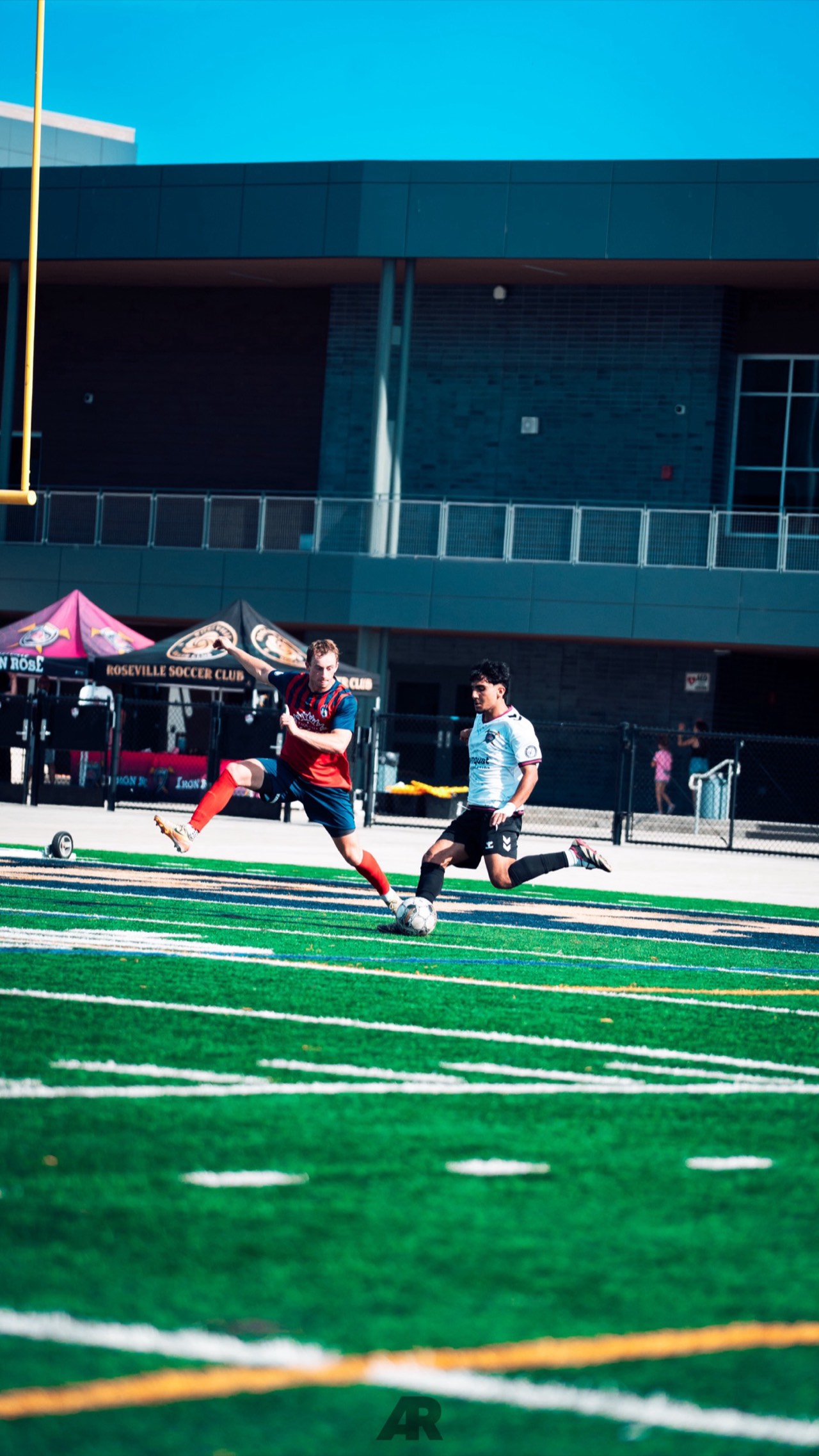 Hamid Safi driving forward during an Iron Rose FC match